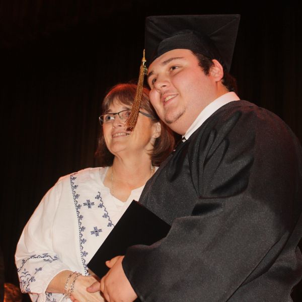  Young man in graduation regalia 